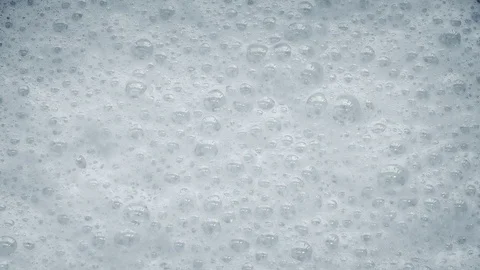 White Foam With Bubbles Popping Stock Footage 77936410