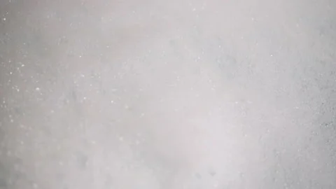 White Foam With Bursting Bubbles. Preparation for taking a bath. Water. Flake. 4 Video stock 147035348