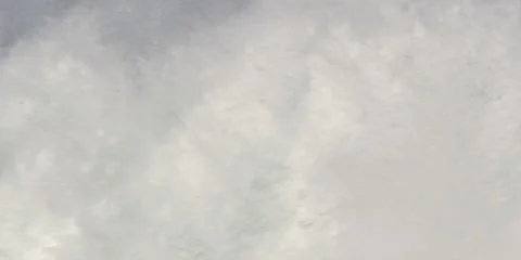 White foam churning in the foreground as sand-laden green waves curl and plunge Stock Footage 59526823