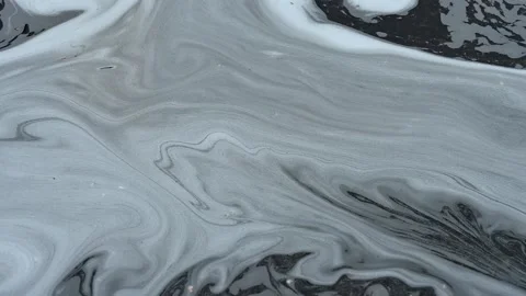 White foam from at detergent floating on the water Stock Footage 145986074