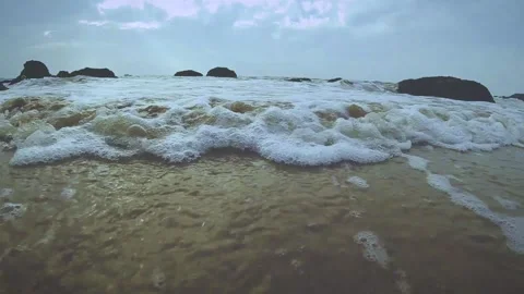 White foam ocean wave on a beach Stock Footage 147739347