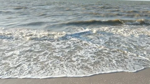 White foam is produced from sea waves Stock Footage 283911164