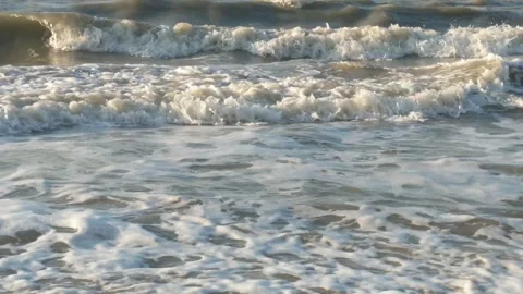 White foam is produced from sea waves Stock Footage 283911978