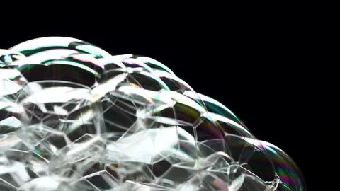 White foam from soap bubbles appears on a black background. it grows and 動画素材 234142472