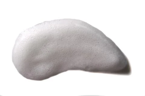 White foam texture on isolated background. Beauty product Stock Photos