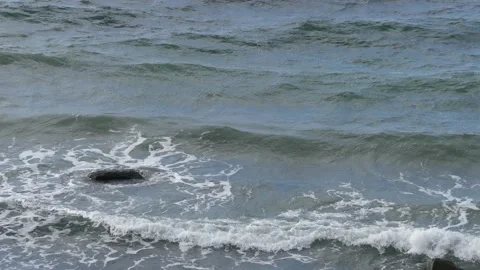 White foaming sea waves in close-up view from a steep coast - top view Stock Footage 139150777