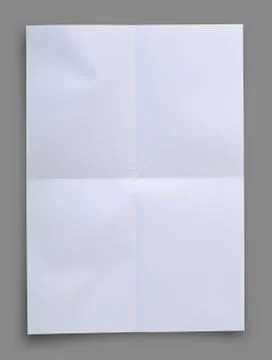 White folded paper on gray  background, clipping path. Stock Photos