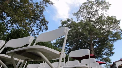 White folding chairs trees dynamic Video stock 92142471