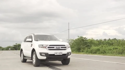 White Ford car passes by Stock Footage 140161249