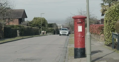 A white ford transit van parking with a man delivering a parcel on a 動画素材 126043110
