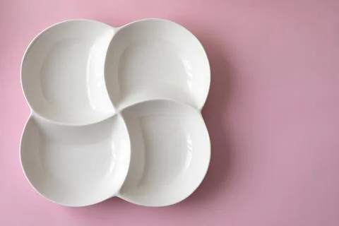 A white four-course dinner plate Stock Photos