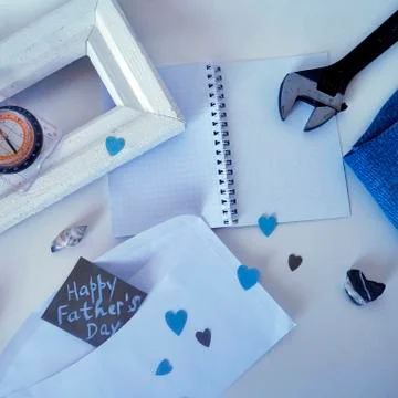 White frame, a compass, a shell and tools on a light background Stock Photos