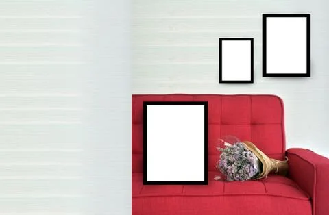 White frame mock up on Red sofa in white room Stock Photos