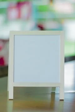 White Frame Mockup Board on Table with Soft Background Stock Photos
