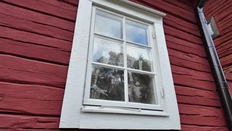 White Framed Window on Red Timber Heritage Wall in Sweden 库存影片 347682751