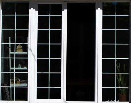 White frames of dark open window on sunny day Stock Photos