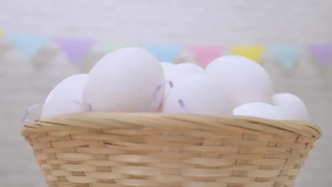 White fresh raw chicken eggs rotating in basket happy easter Stock Footage 171434497