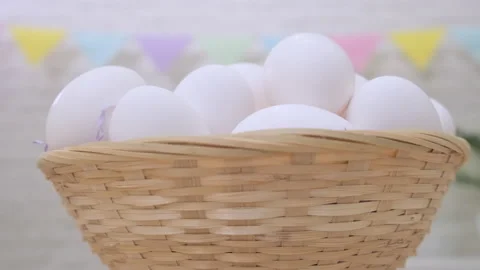 White fresh raw chicken eggs rotation in basket, happy easter Stock Footage 234263710