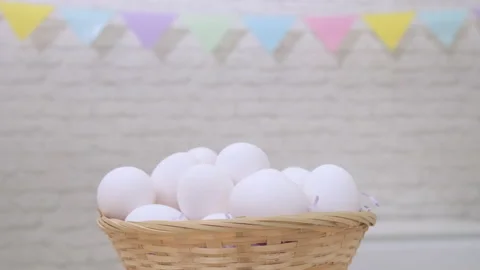 White fresh raw chicken eggs rotation in basket, happy easter. Spinning eggs Video stock 234482664