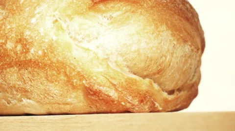 White freshly baked bread moving on a stand Stock Footage 67674987
