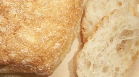 White freshly baked bread sliced on a stand Stock Footage 67674964