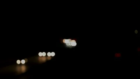 White front and red rear lights as a bokeh effect at night Stock-Footage 231694225