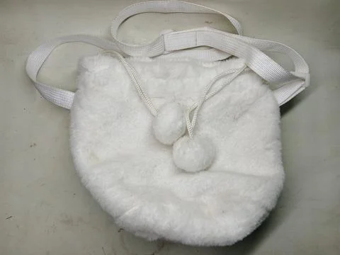 White furry drawstring pouch bag with strap Stock Photos