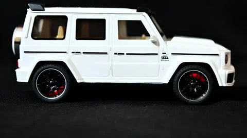 A White G-Wagon SUV Car coming and stopping into the frame, 4k footage with Video stock 299516092