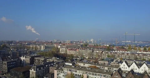 White gabled terraces facing the working harbor and cranes Stock-Footage 71294567