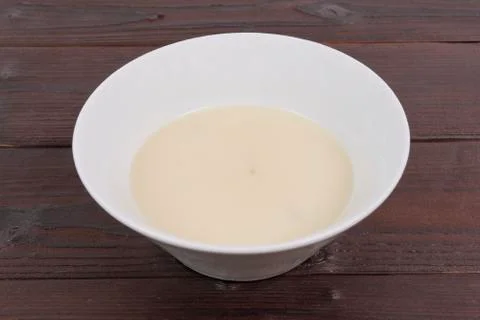 White garlic soup on a table Foto stock