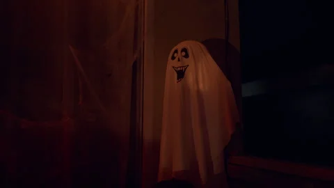 White Ghost Decoration Standing Near Window With Cobwebs in Dark Interior, Hallo Stock Footage 337103233