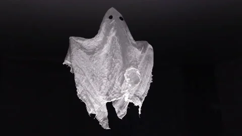 A white ghost made of fabric floating at night under the ceiling close-up Stock Footage 227332702