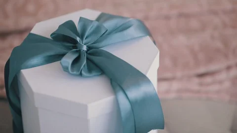 White gift box with blue bow Stock Footage 122016629