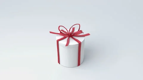 White gift box, cylinder with red ribbon closing. Video stock 44104894