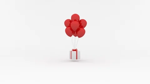 White gift box hanging on red balloons. Christmas or birthday concept. 库存影片 93691295