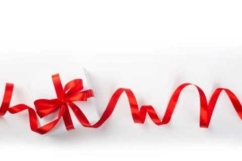 White gift box with red bow Stock Photos