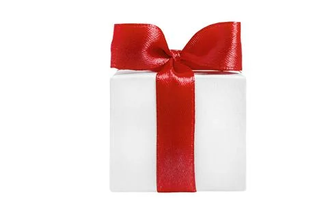 White gift box with a red bow on a white background Stock Photos