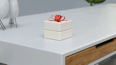 White gift box with red ribbon on white table. Jewel box with red bow. 3d render Stock Footage 126001785