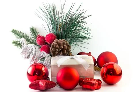 White gift box with silver and red decorations on pure white background Stock Photos