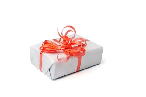 White gift box with a silver bow on white background Stock-Fotos