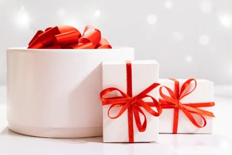 White gift boxes with red ribbon. Holiday concept. Stock Photos