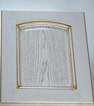 White gilded rectangular kitchen facade close up. wood textured decorative el Foto stock