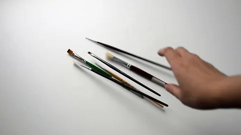 White girl throws six brushes Stock Footage 117600732