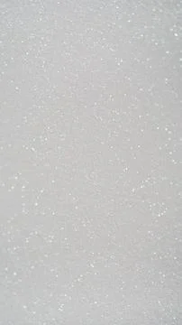White glitter background with sparkling texture for design, craft, or decor.. Фото