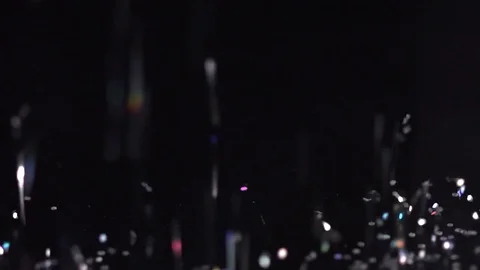 White glitter falling on the black background, abstract slow motion Stock Footage 75966585