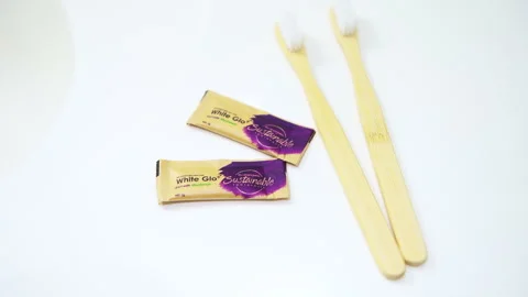 White glo whitening toothpaste, toothbrush disposable wooden bamboo hygiene Stock Footage 251246977
