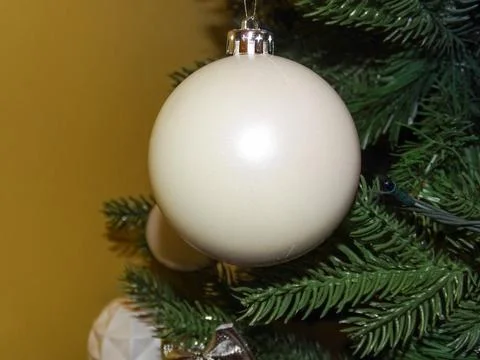 White globe in a Christmas tree 写真素材