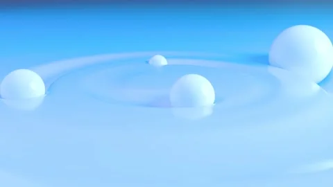 White Glossy Orbs on Light Blue Surface - Close-Up Depth of Field 4K Loop Stock Footage 307458768