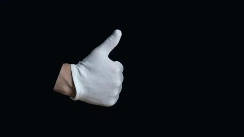 White-gloved hand on a black background. hand in white glove showing sign - t Stock Photos