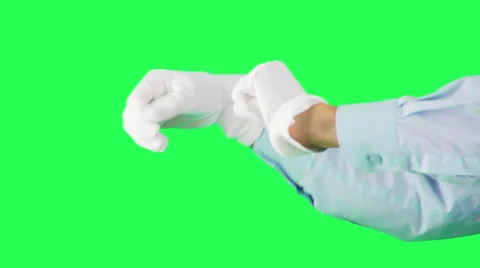 White-gloved hands on a green background dancing  Stock Footage 41592273